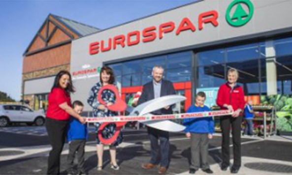 Locally loved teacher cuts the ribbon on state-of-the-art Community Supermarket